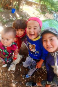 Young children and toddlers happily posed for the camera, smiling widely